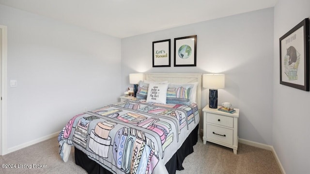 bedroom featuring light colored carpet