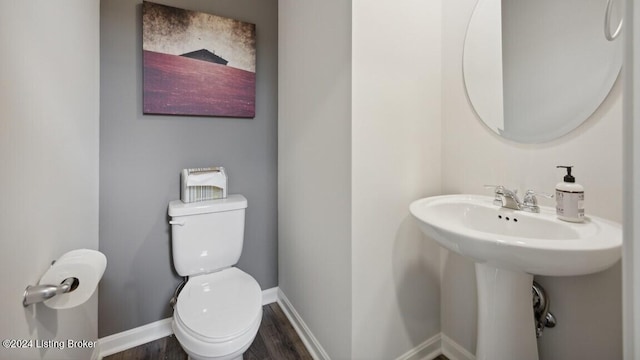 bathroom featuring toilet and hardwood / wood-style flooring