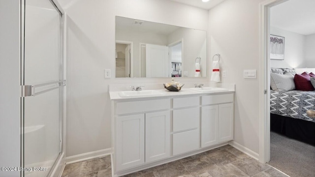 bathroom featuring vanity and an enclosed shower