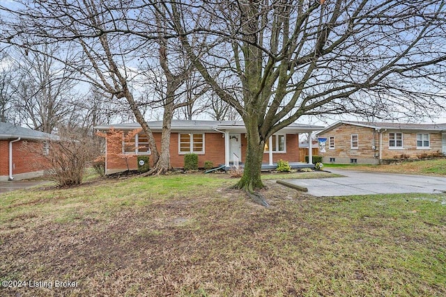 ranch-style home featuring a front yard