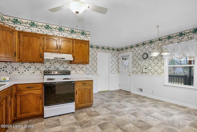 kitchen featuring white range with electric cooktop, ceiling fan, and hanging light fixtures