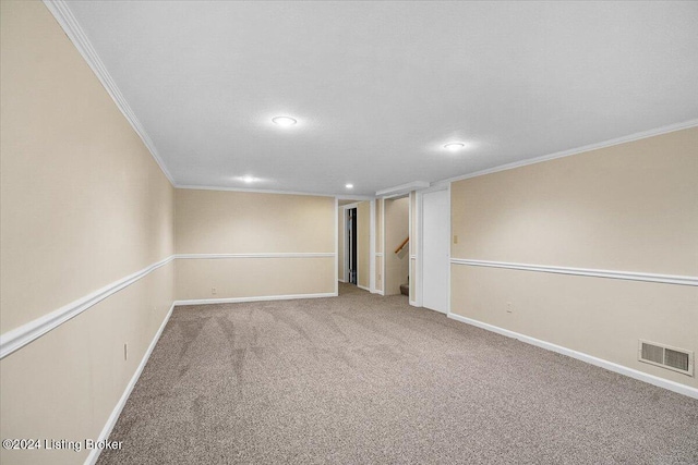 spare room with carpet flooring and ornamental molding