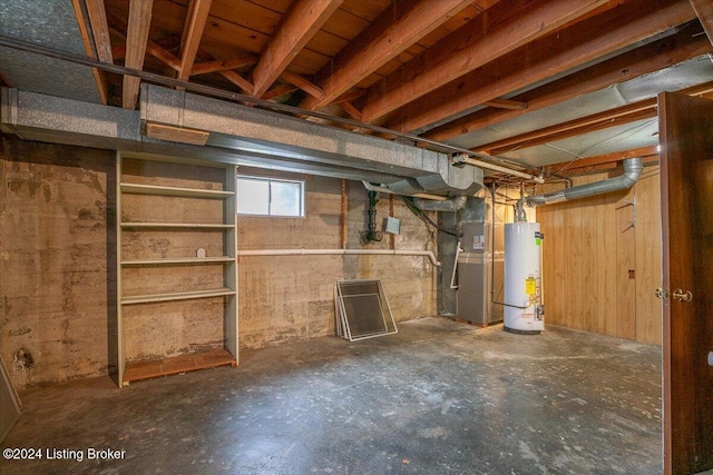 basement featuring gas water heater and heating unit