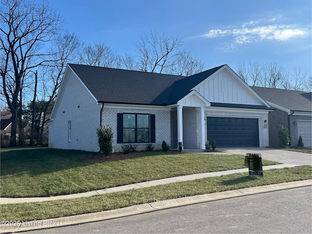 view of front of property featuring a front yard and a garage