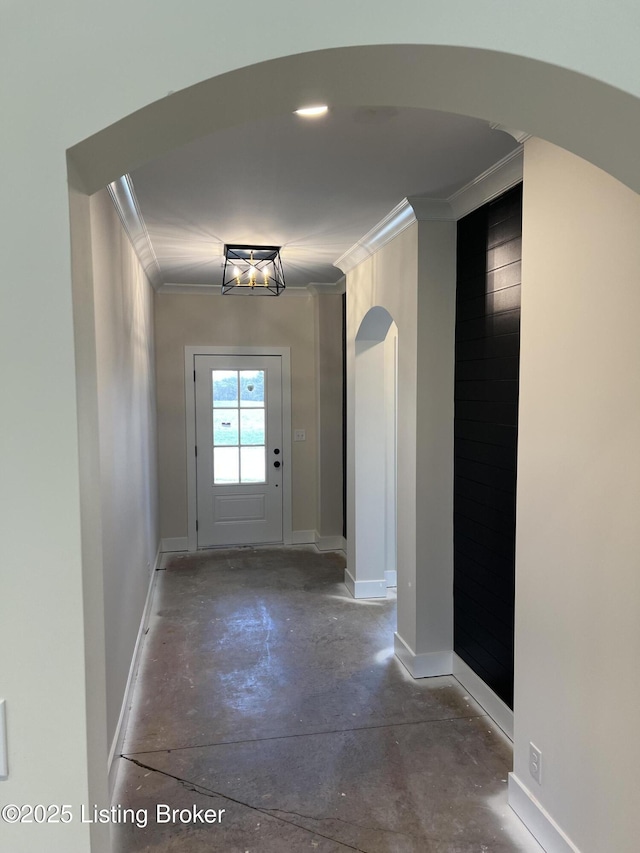 doorway featuring crown molding