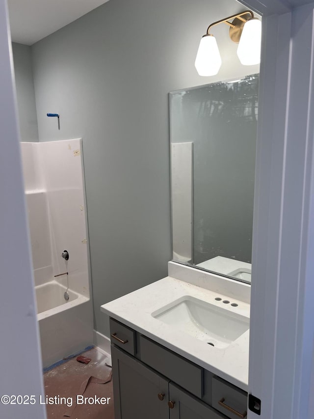 bathroom featuring vanity and washtub / shower combination