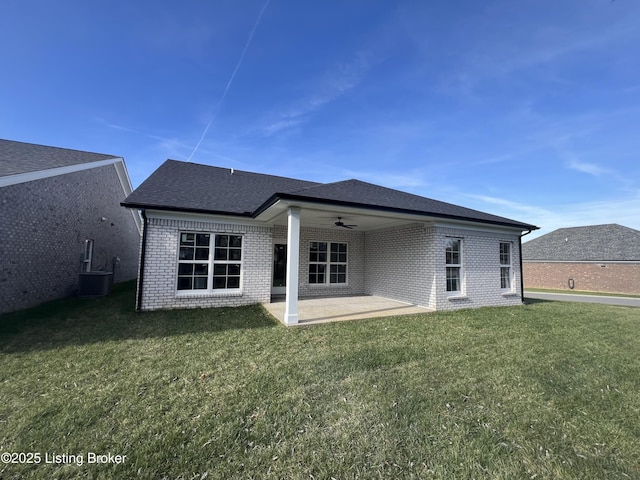 back of house with cooling unit, a patio area, ceiling fan, and a yard