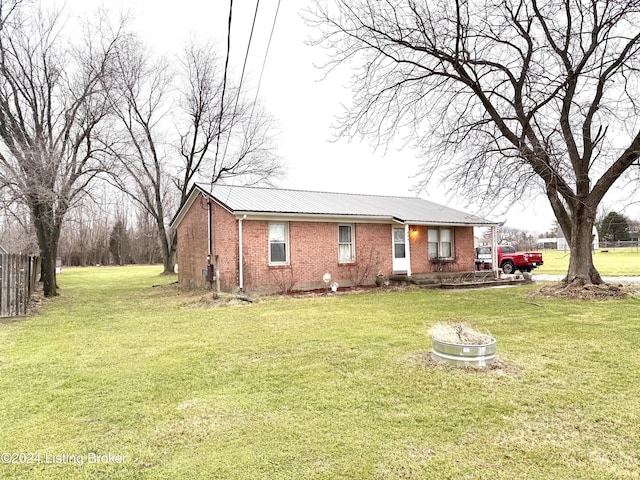 single story home with a front yard