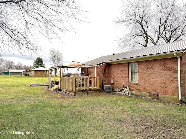 view of yard with a wooden deck