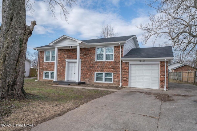 bi-level home featuring a garage