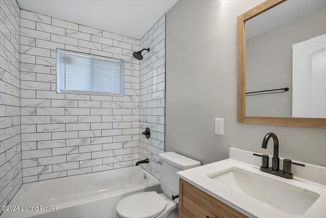 full bathroom with vanity, toilet, and tiled shower / bath combo