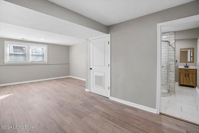 interior space featuring light hardwood / wood-style floors and sink