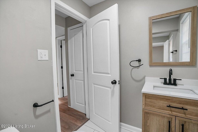 bathroom with tile patterned flooring and vanity