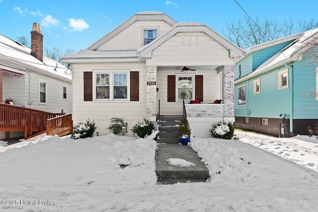 bungalow featuring covered porch and ceiling fan