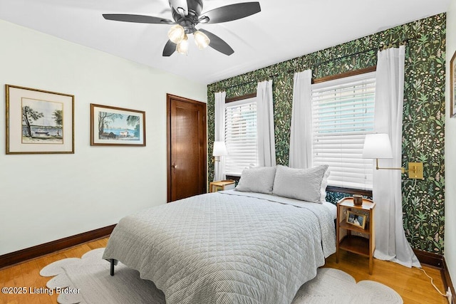 bedroom with ceiling fan and light wood-type flooring