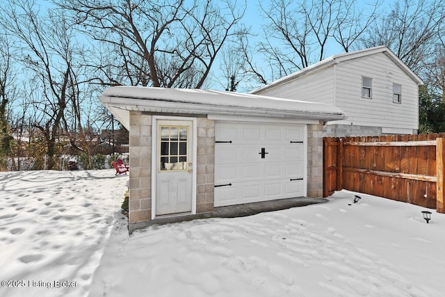 view of snow covered garage