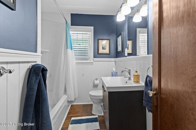 full bathroom with toilet, wood-type flooring, vanity, and shower / bath combo with shower curtain