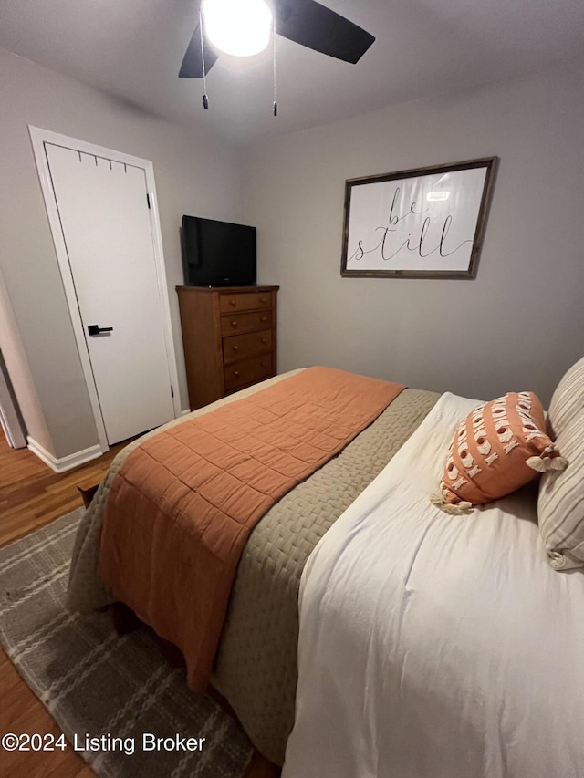 bedroom featuring ceiling fan and wood-type flooring