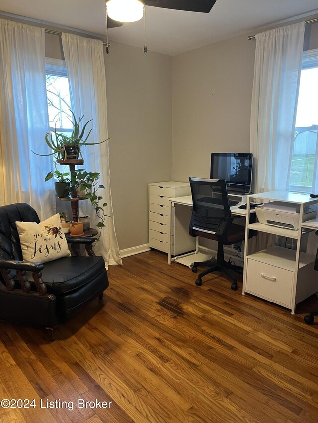 home office featuring ceiling fan and dark wood-type flooring