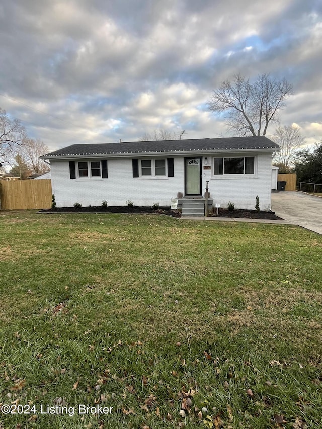 ranch-style house with a front lawn