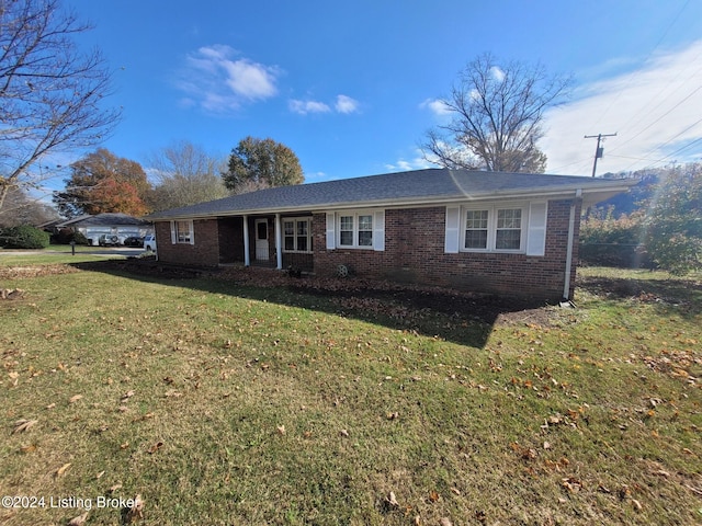 ranch-style home with a front lawn