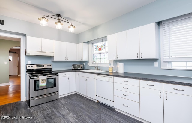 kitchen with white cabinetry, dishwasher, sink, dark hardwood / wood-style floors, and stainless steel range with electric cooktop