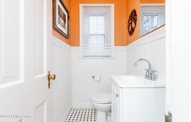 bathroom featuring vanity and toilet