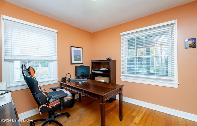 office with light hardwood / wood-style flooring