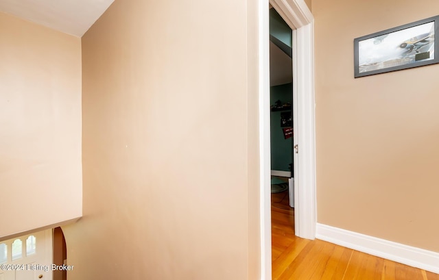 corridor with light wood-type flooring