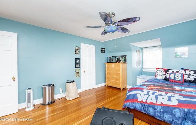 bedroom with hardwood / wood-style flooring and ceiling fan