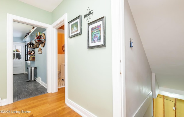 corridor featuring hardwood / wood-style flooring