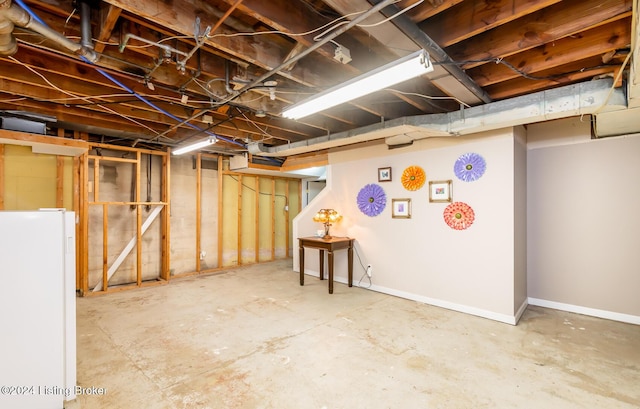 basement featuring white fridge