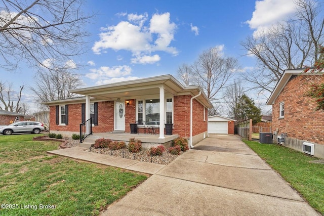 view of front of property featuring cooling unit, a front lawn, a garage, an outbuilding, and a porch