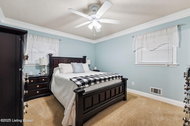 carpeted bedroom featuring ceiling fan and ornamental molding