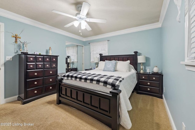 carpeted bedroom featuring ceiling fan and ornamental molding