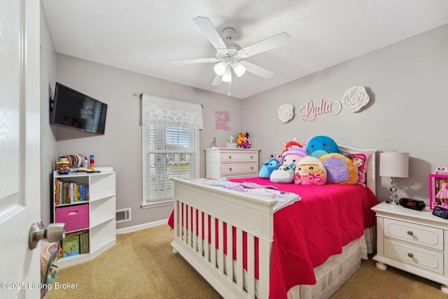 bedroom featuring light carpet and ceiling fan