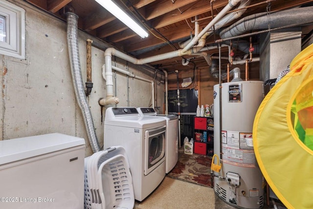 laundry room featuring gas water heater and separate washer and dryer