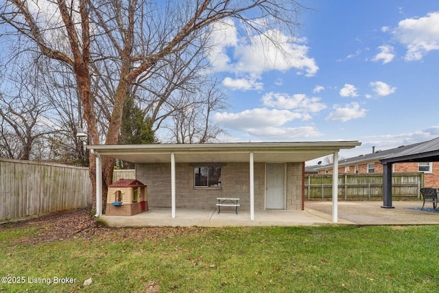 view of outbuilding featuring a lawn