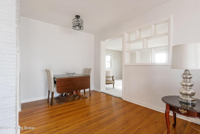 interior space with hardwood / wood-style floors and a chandelier