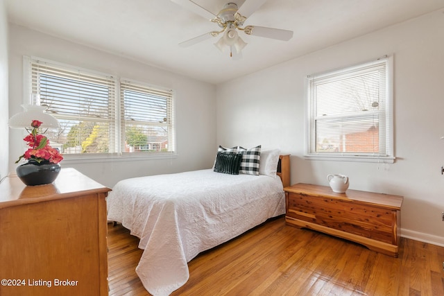 bedroom featuring hardwood / wood-style flooring and ceiling fan