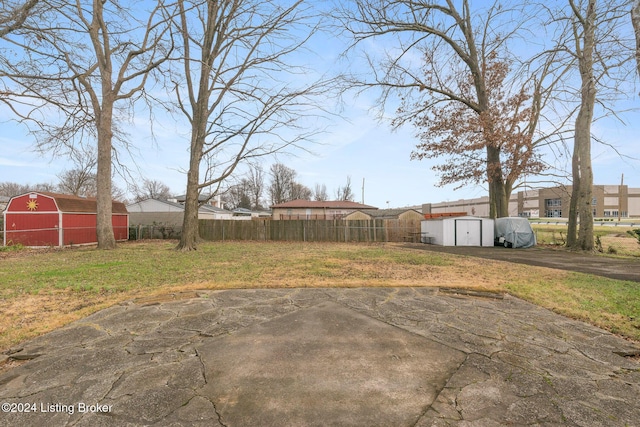 view of yard featuring an outbuilding and a patio