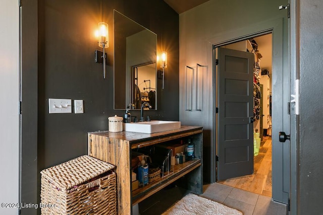 bathroom with tile patterned flooring and vanity