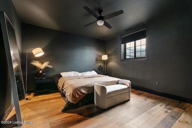 bedroom featuring ceiling fan and light wood-type flooring