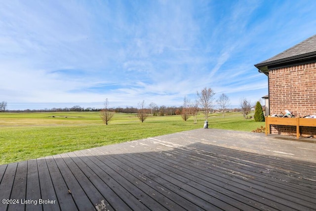 wooden deck with a lawn