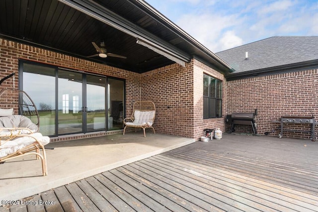 wooden terrace featuring ceiling fan