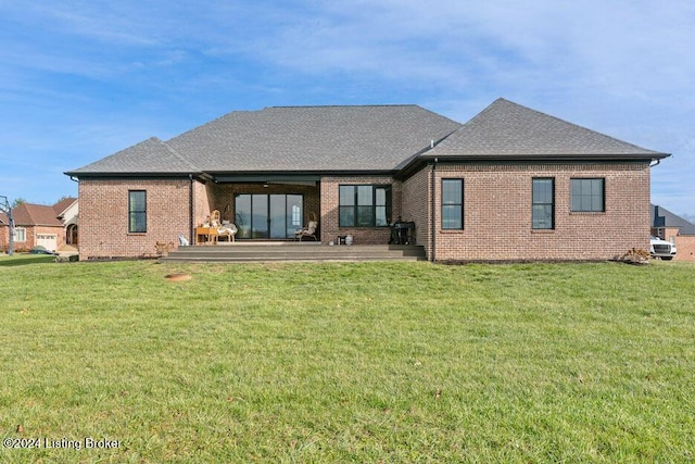 back of house featuring a yard and a patio area