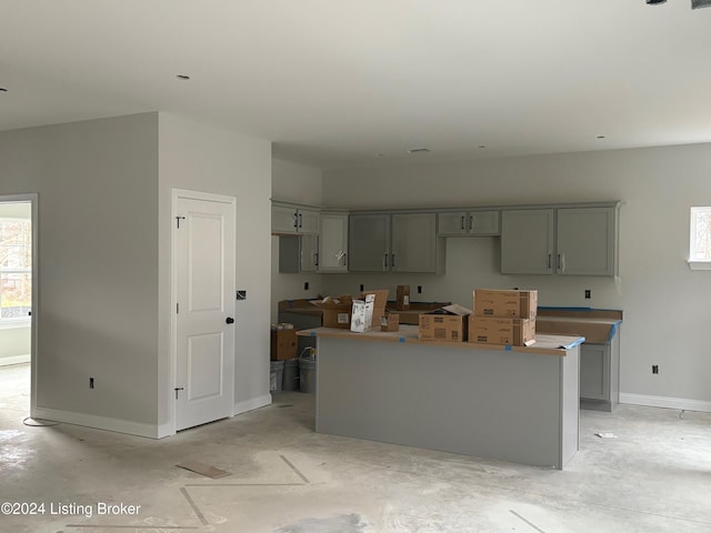 kitchen with a center island and gray cabinetry