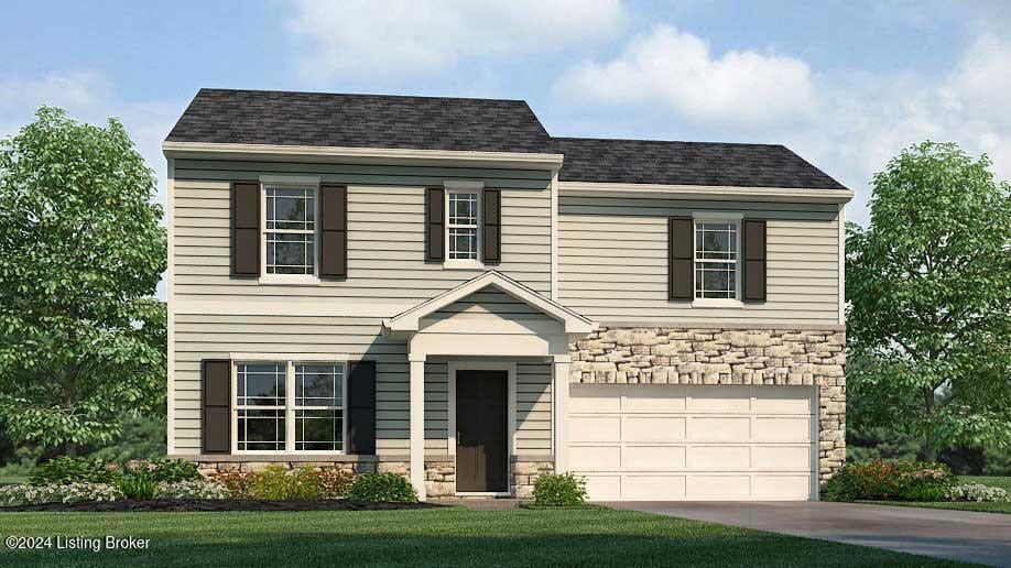 view of front of house with a front yard and a garage