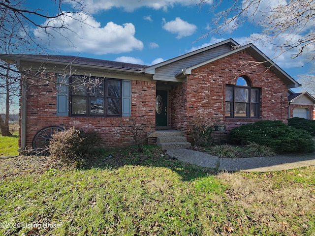 view of front of home with a front lawn