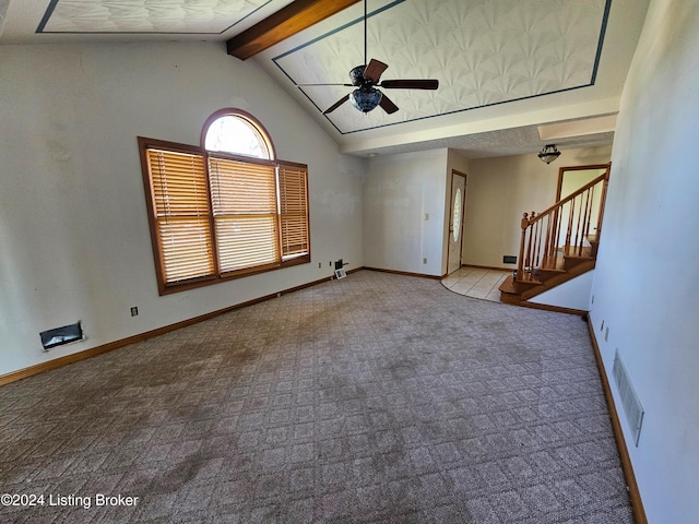 unfurnished living room featuring vaulted ceiling with beams, ceiling fan, and carpet floors